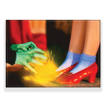Dorothy wearing Ruby Slippers from The Wizard of Oz and the witches green handswith sparks in the background